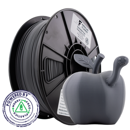 Spool of filament and a 3D printed object with a 'Powered by Worry Free Plastics' badge on a white background